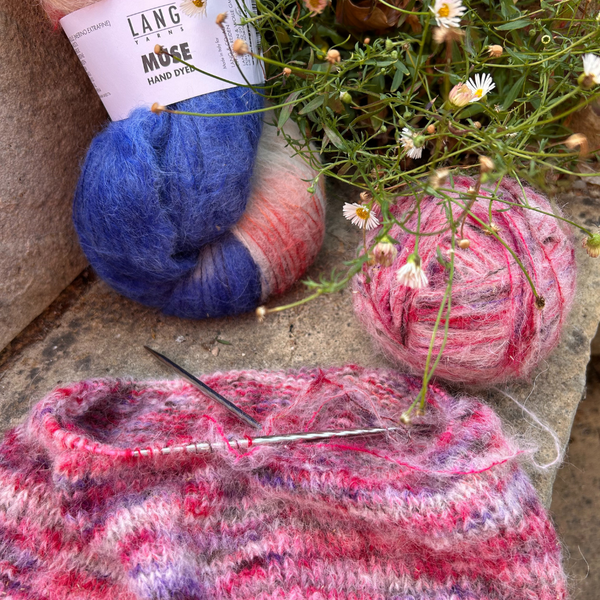 Close-up of knitted fabric highlighting sheen and colour blending