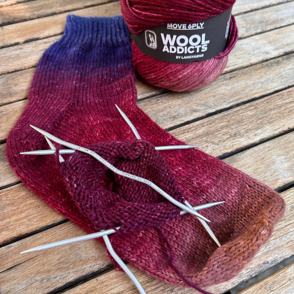 Finished socks made with WOOL ADDICTS MOVE 6-Ply in bright shades