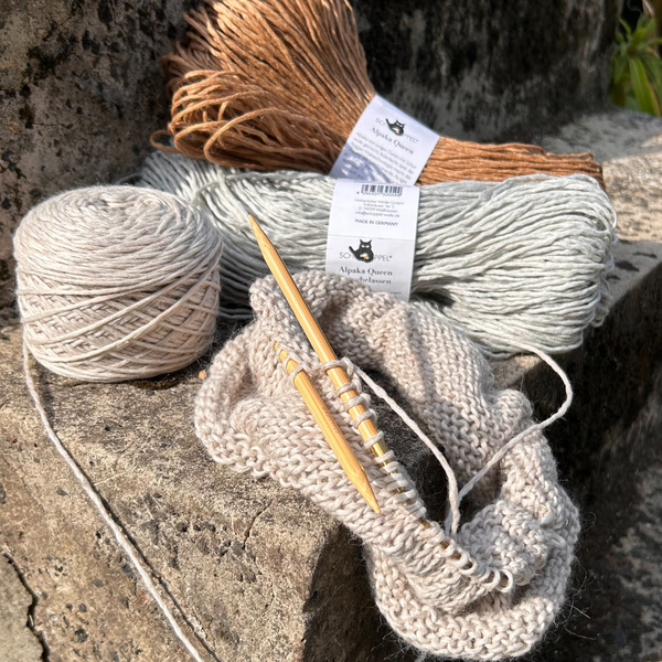 Schoppel Alpaca Queen Natural yarn on concrete steep