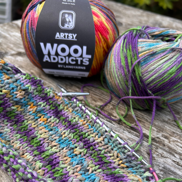 Close-up of ARTSY knitted swatch highlighting stitch definition and colour depth