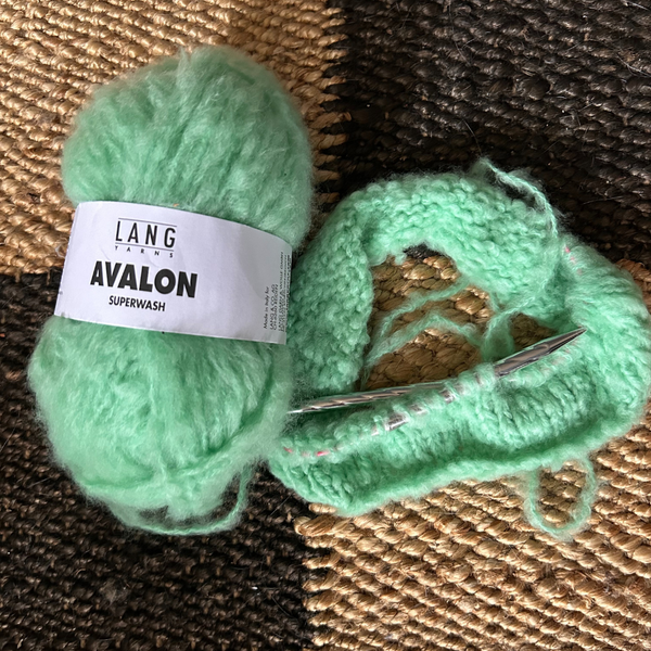 Ball of AVALON yarn showing soft outer halo over firm core