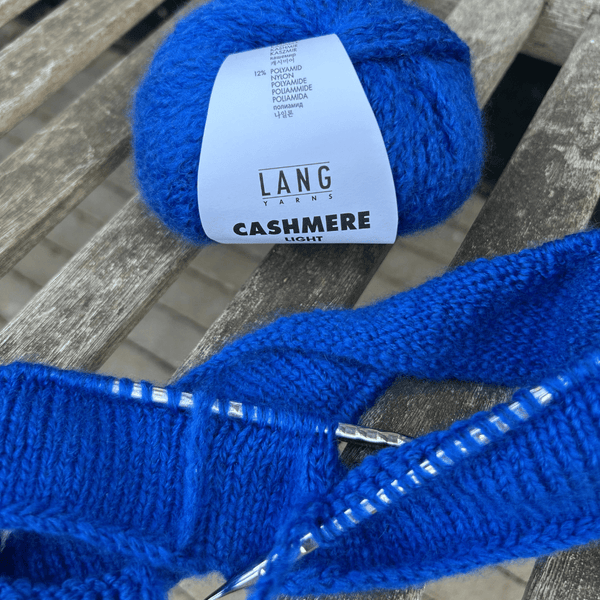 Close-up of CASHMERE LIGHT stitches highlighting softness and drape