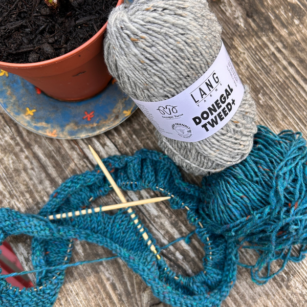Close-up of DONEGAL TWEED + stitches revealing authentic Donegal flecks