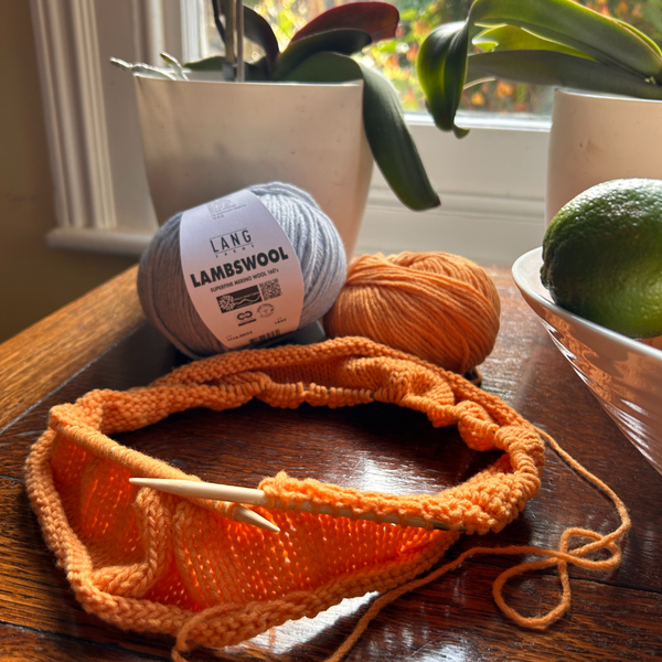Knitting with Close-up of knitted fabric in LAMBSWOOL highlighting fine stitch definition
