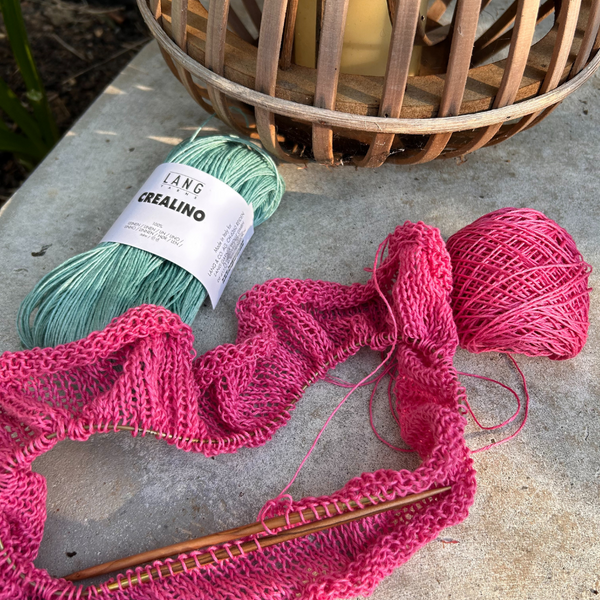 Close-up of CREALINO stitches highlighting smooth drape and sheen