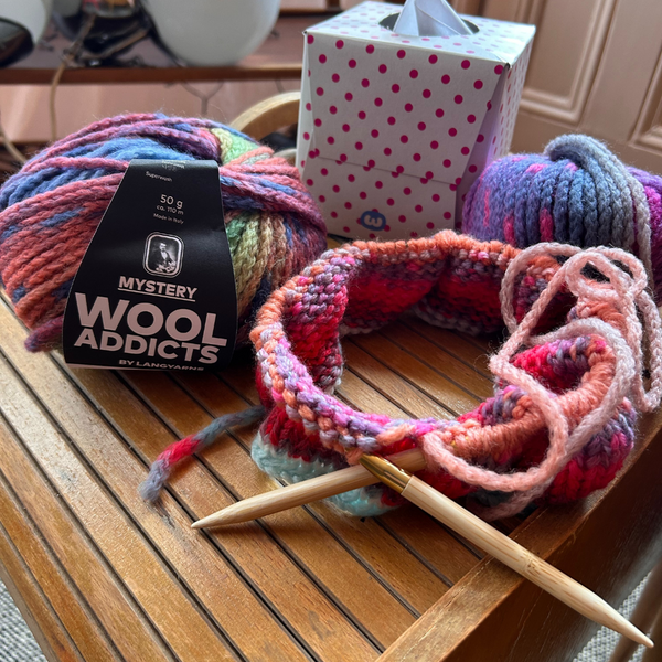 Ball of WOOLADDICTS MYSTERY showing soft, fluffy merino texture