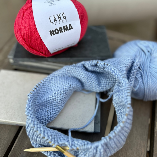 Close-up of knitted NORMA fabric showing wool-like loft and stitch definition