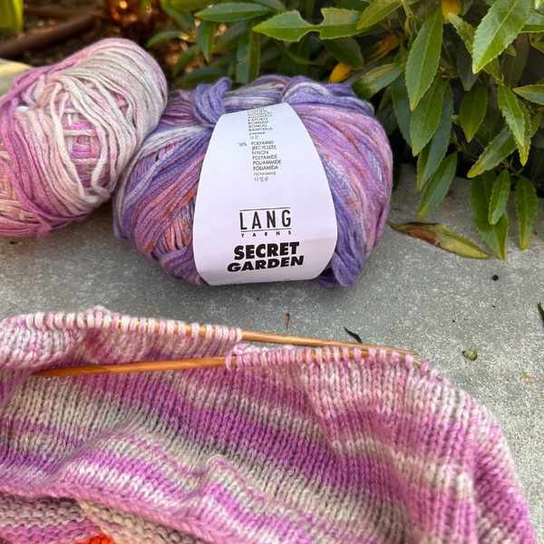 Secret Garden wool balls and knitting in a garden