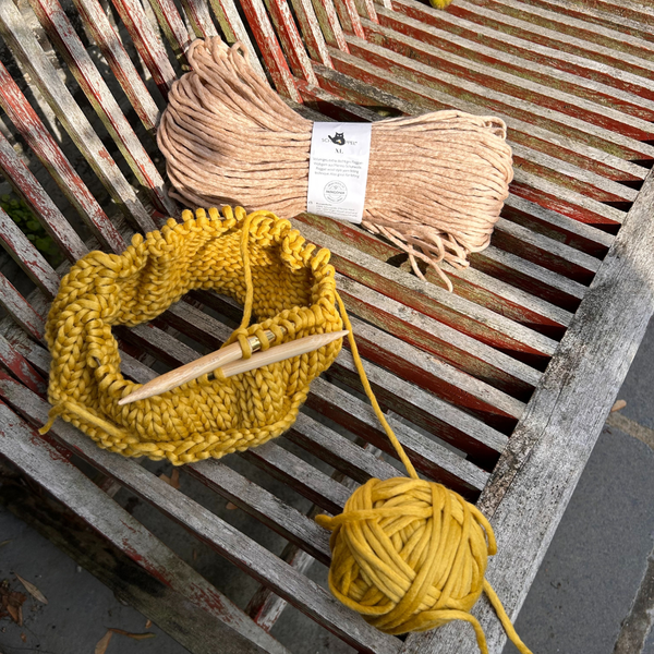 Knitting on a garden seat